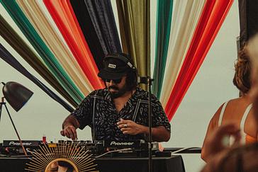 Viajero Hostels | Viajero Sayulita | DJ playing music at a party located on the terrace of Viajero Sayulita.