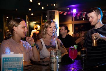Viajero Hostels | Viajero Buenos Aires | Tourists enjoying a cocktail, meeting new people at a party in Buenos Aires, Argentina, inside Viajero Hostels.