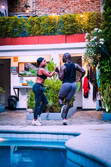 Viajero Hostels | Viajero Cali | Couple dancing salsa in the pool area of Viajero Hostels Cali.