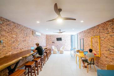 Viajero Hostels | Viajero Sayulita | Travelers using the coworking space, with power outlets, free WiFi, and multiple tables, working from paradise at Viajero Hostels Sayulita.