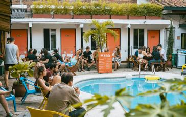 Viajero Hostels | Viajero Cali | People enjoying a peaceful afternoon in the pool area of Viajero Cali.